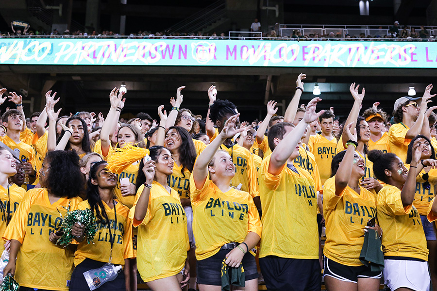 Students cheering at McLane Stadium